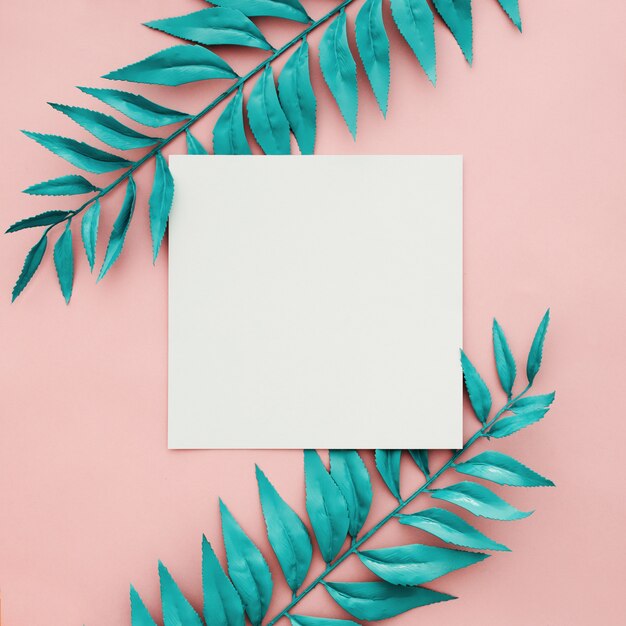 Beautiful blue border leaves on pink background with blank frame