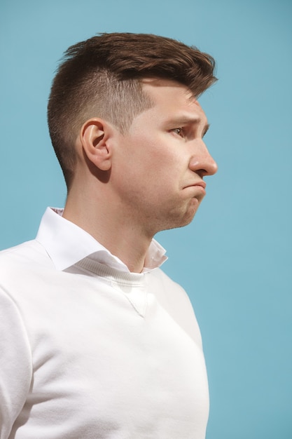 Beautiful bored man isolated on studio background