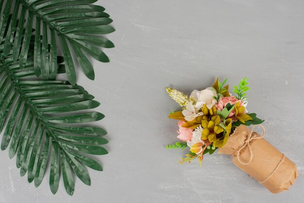 Beautiful bouquet of flowers on grey surface