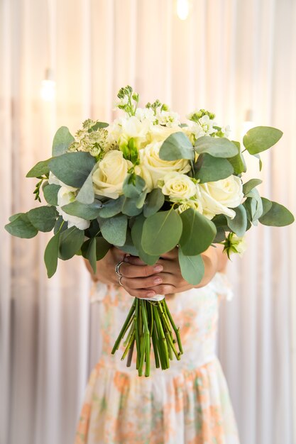 A beautiful bouquet in the girl's hands ,close-up ,holiday concept