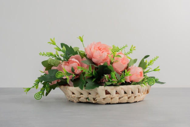 Beautiful bouquet of pink roses on grey table