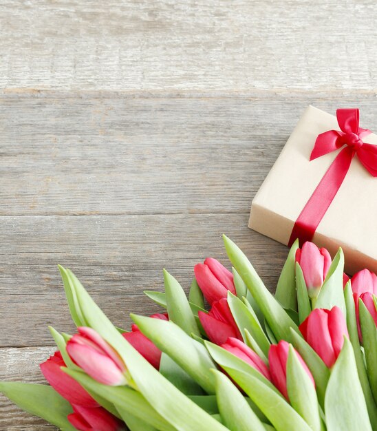 Beautiful bouquet of tulips and gift box