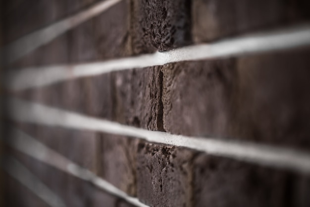 Free photo beautiful brick wall, dark brown closeup