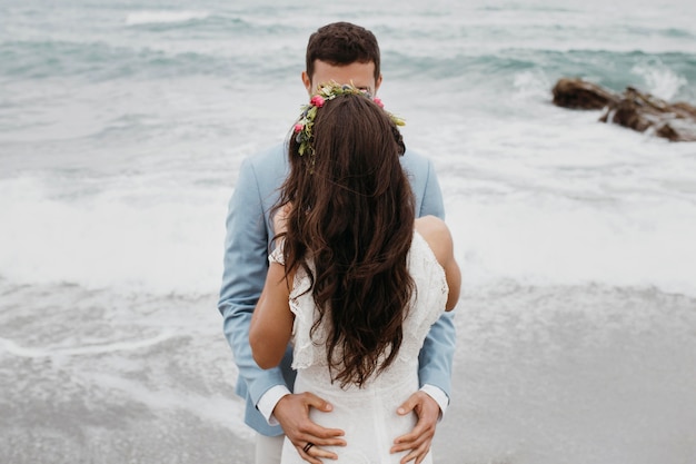 Beautiful bride and groom at the beach