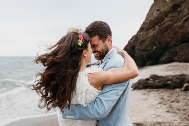 Beautiful bride and groom at the beach