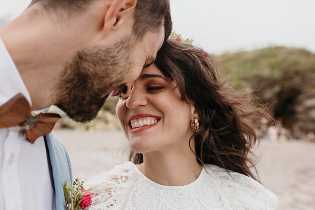 Beautiful bride and groom at the beach