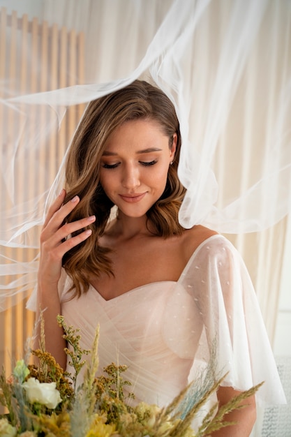 Beautiful bride holding flowers medium shot