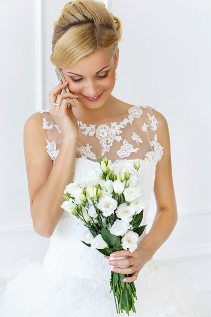 Beautiful bride talking with the phone