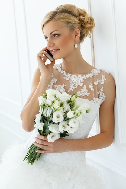 Beautiful bride talking with the phone