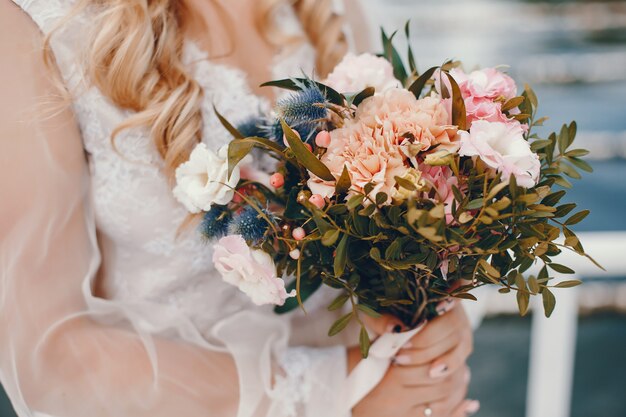 Beautiful bride with her husband in a park