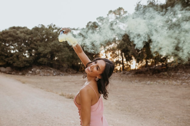 Beautiful bridesmaid smiling outdoors