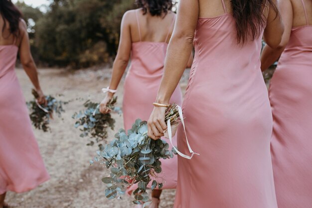 Beautiful bridesmaids celebrating their friend's wedding