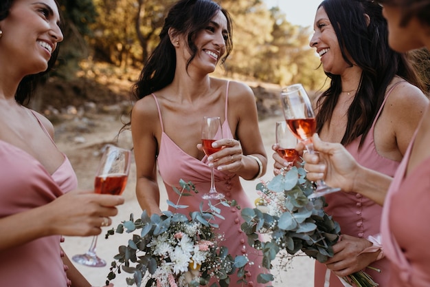 Beautiful bridesmaids celebrating their friend's wedding
