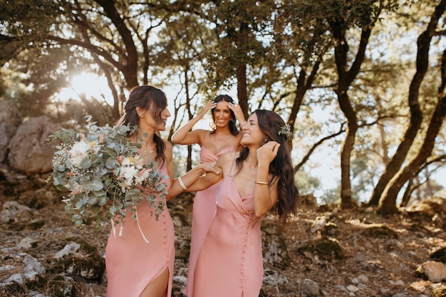 Beautiful bridesmaids in pretty dresses outdoors