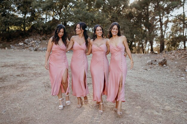 Beautiful bridesmaids in pretty dresses outdoors