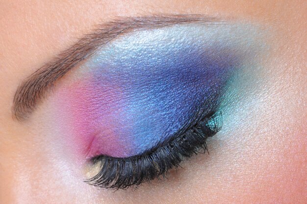 Beautiful bright fashion makeup of female eye - macro shot
