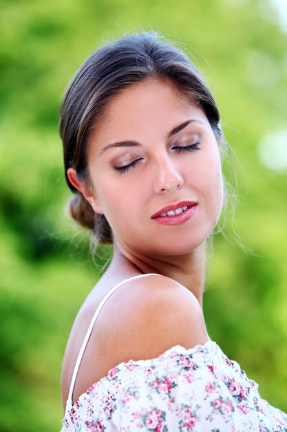 Beautiful brunette over green