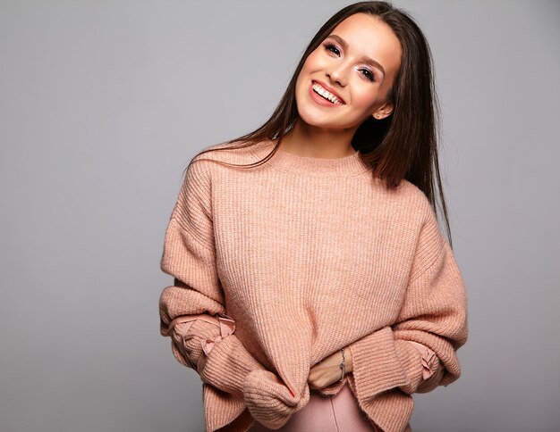 beautiful brunette model in casual beige warm sweater