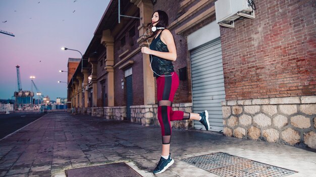 Beautiful brunette running on sidewalk