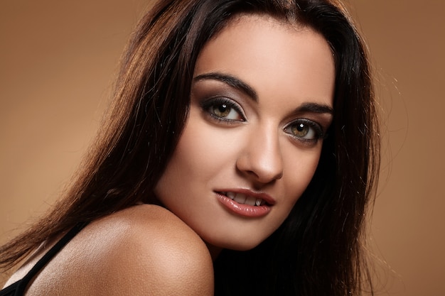 Beautiful brunette with evening makeup