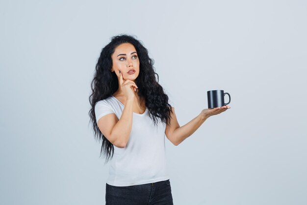 Beautiful brunette woman holding a mug