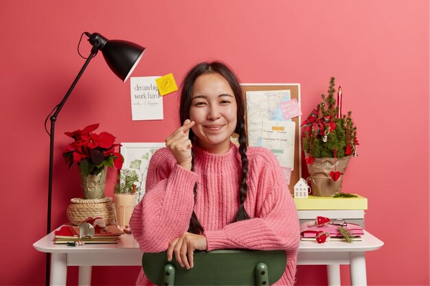 Beautiful brunette woman staying in her workplace