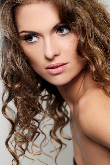 Beautiful brunette woman with curls