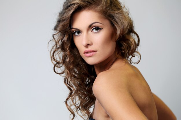 Beautiful brunette woman with curls