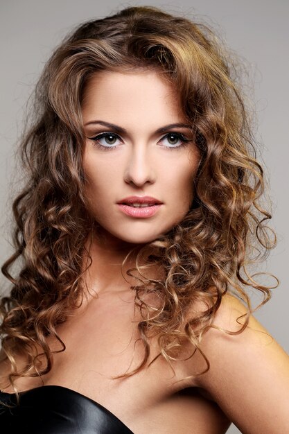 Beautiful brunette woman with curls