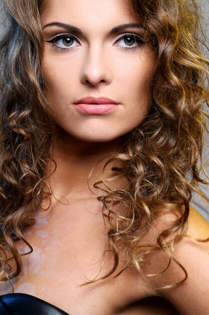 Beautiful brunette woman with curls