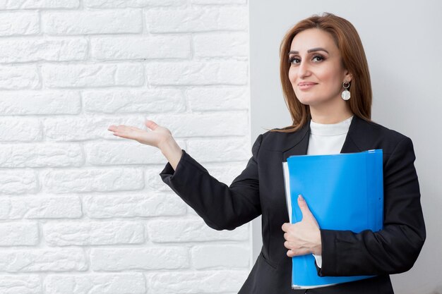 Beautiful business lady holding her hands open in air and smiling