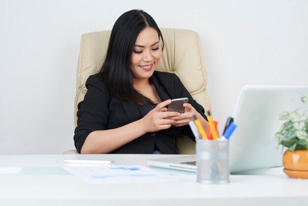 Beautiful business lady texting