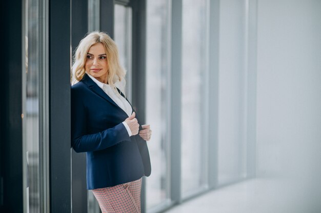 Beautiful business woman at the office by the window