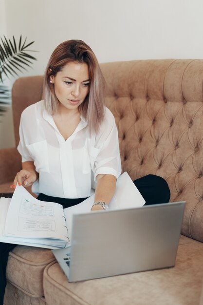 Beautiful business woman working at home.