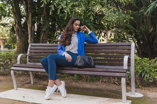 Free photo beautiful businesswoman thinking in the park