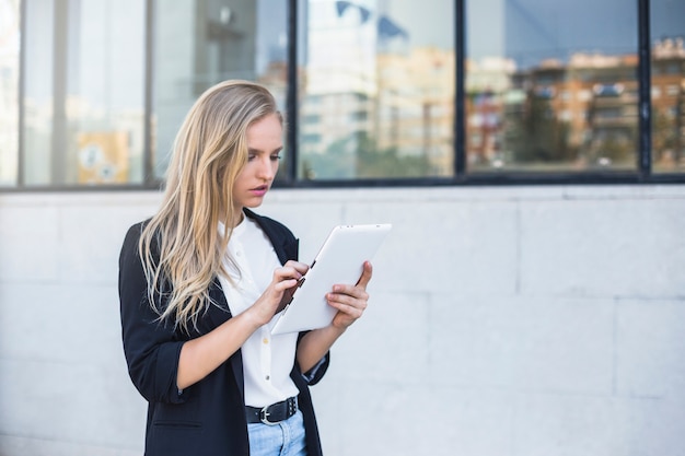 Beautiful businesswoman using digital tablet