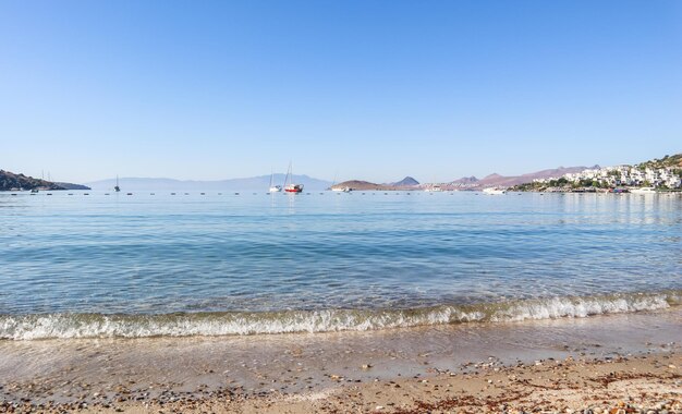 Beautiful calm blue bay with sand beach in mediterranean. holiday and relaxation on sea coast