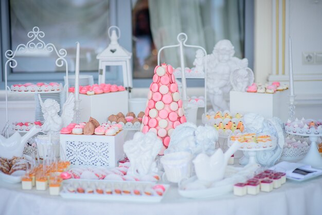 Beautiful candy bar of pink and white sweets decorated