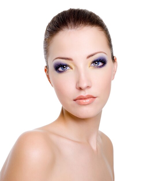 Beautiful caucasian female face with bright fashion makeup