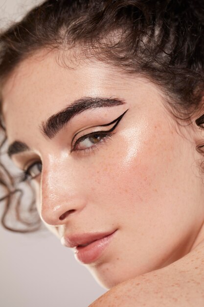 beautiful caucasian woman with black eyeliner