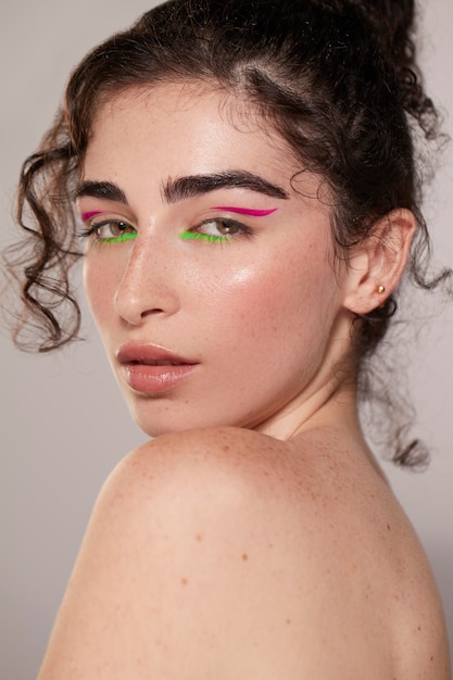 Beautiful caucasian woman with colorful eyeliner