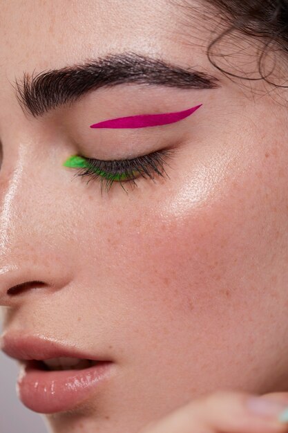 beautiful caucasian woman with colorful eyeliner