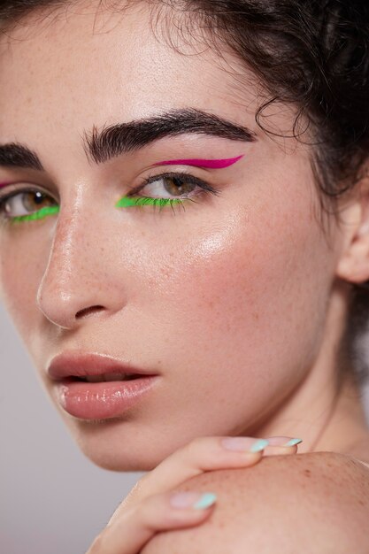 Beautiful caucasian woman with colorful eyeliner