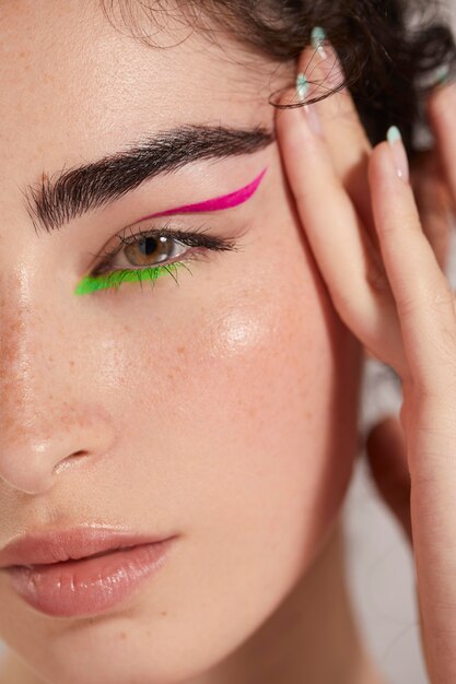 Beautiful caucasian woman with colorful eyeliner