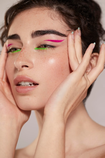 Beautiful caucasian woman with colorful eyeliner