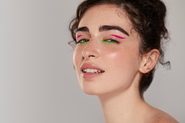 Beautiful caucasian woman with colorful eyeliner