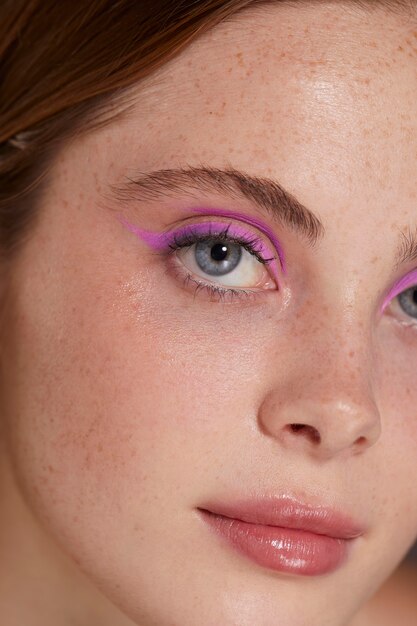 Beautiful caucasian woman with pink eyeliner