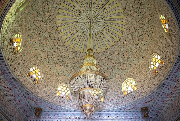 Beautiful ceiling in Islamic, Muslim style with large chandelier and vintage windows