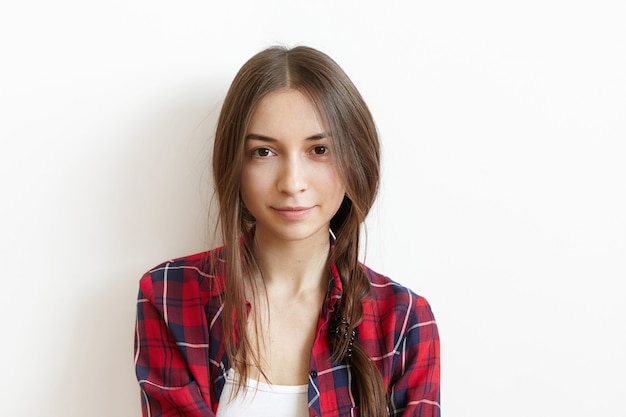 Free photo beautiful and charming young caucasian female with brown eyes and messy dark hair