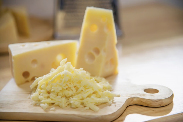 Free photo beautiful cheeses in the kitchen - cheese food preparing concept